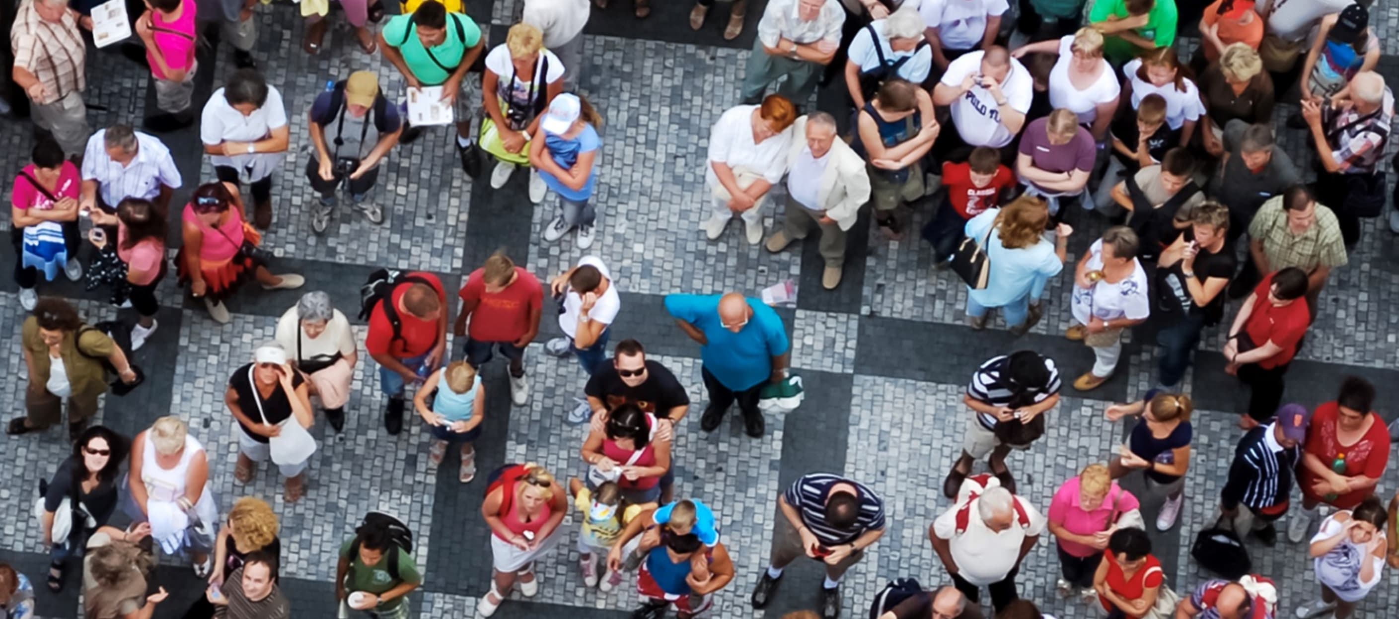 a bird's eye view of people queuing up on multiple lines