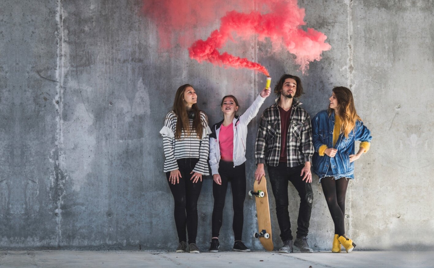 an image of young people playing with colour powder
